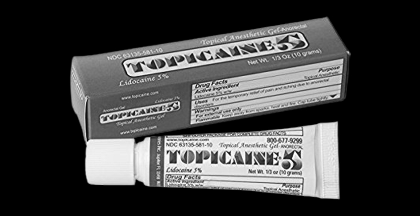 Box and tube of topical anesthetic gel labeled Topicaine 5% (lidocaine) for numbing tissue.