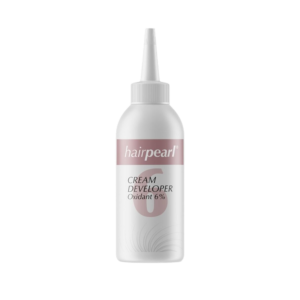White plastic bottle with a pointed nozzle, labeled hairpearl Cream Developer Oxidant 6% on a pink bandicage.