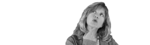 Thoughtful woman with light hair in a blazer, looking upward with her hand on her chin (black and white).